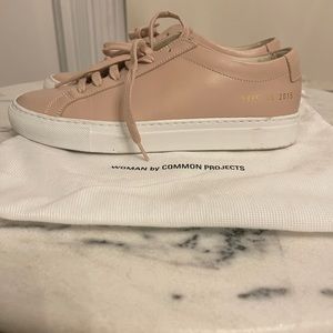Pink common project sneakers